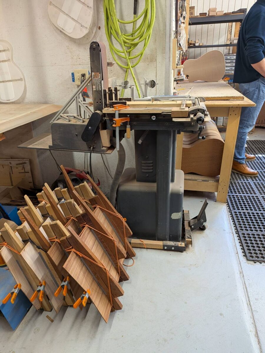 Guitar bodies and backs being glued with clamps