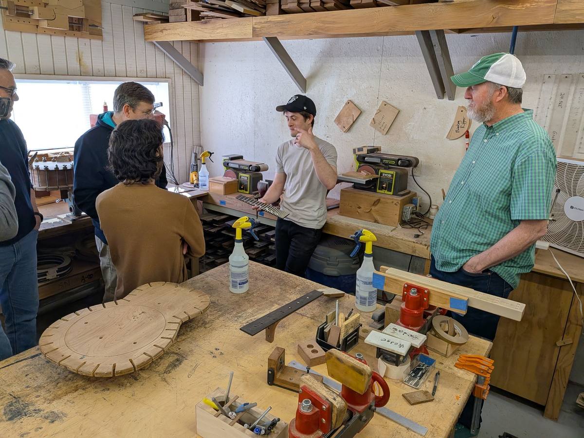 Ben Beard at the workbench with guitar body forms